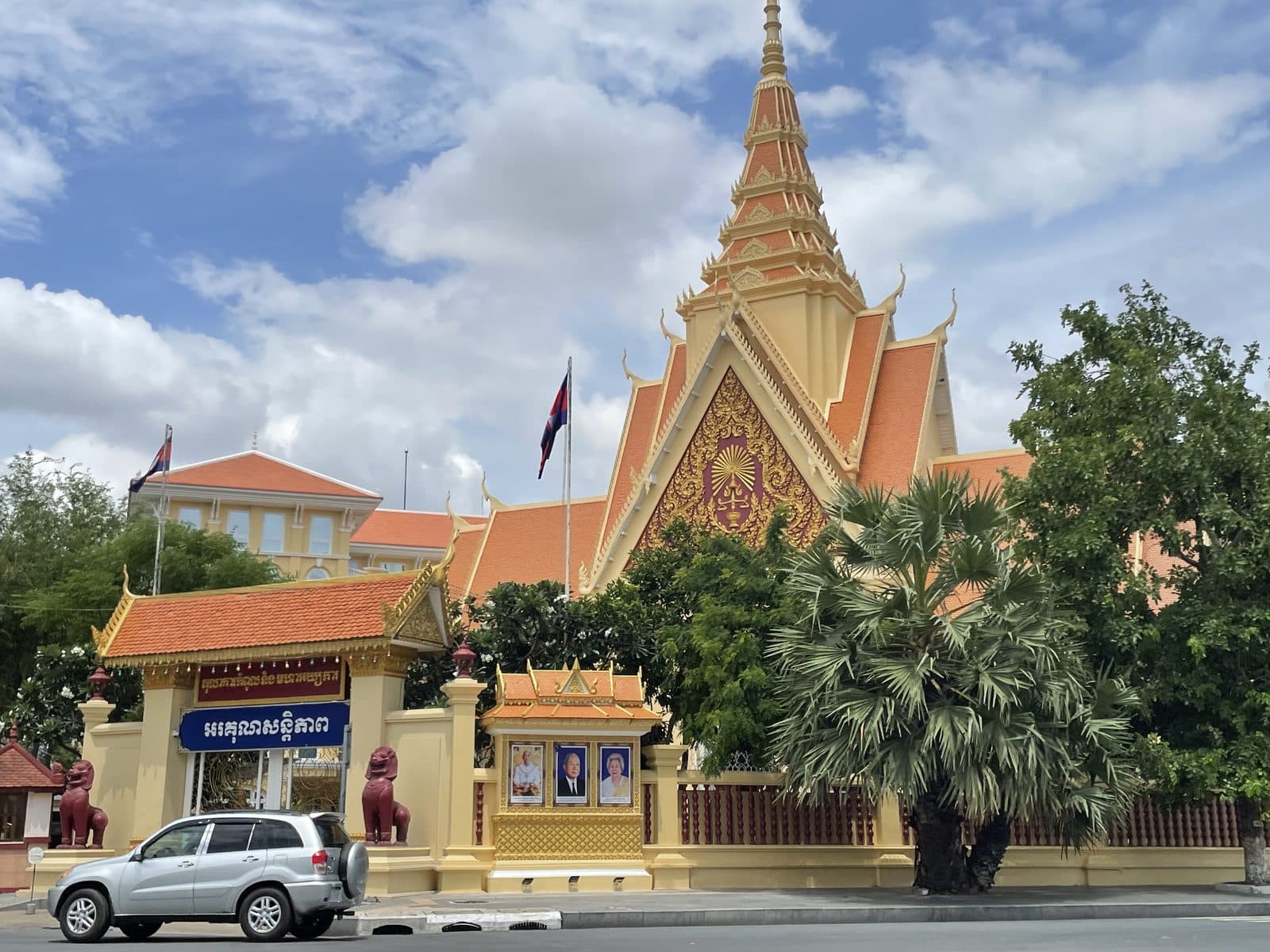 A temple building on a quiet Phnom Penh street, seen from the road